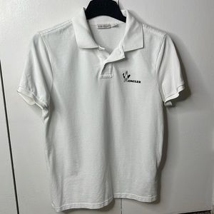 Moncler polo with logo. Elegant and gently worn.